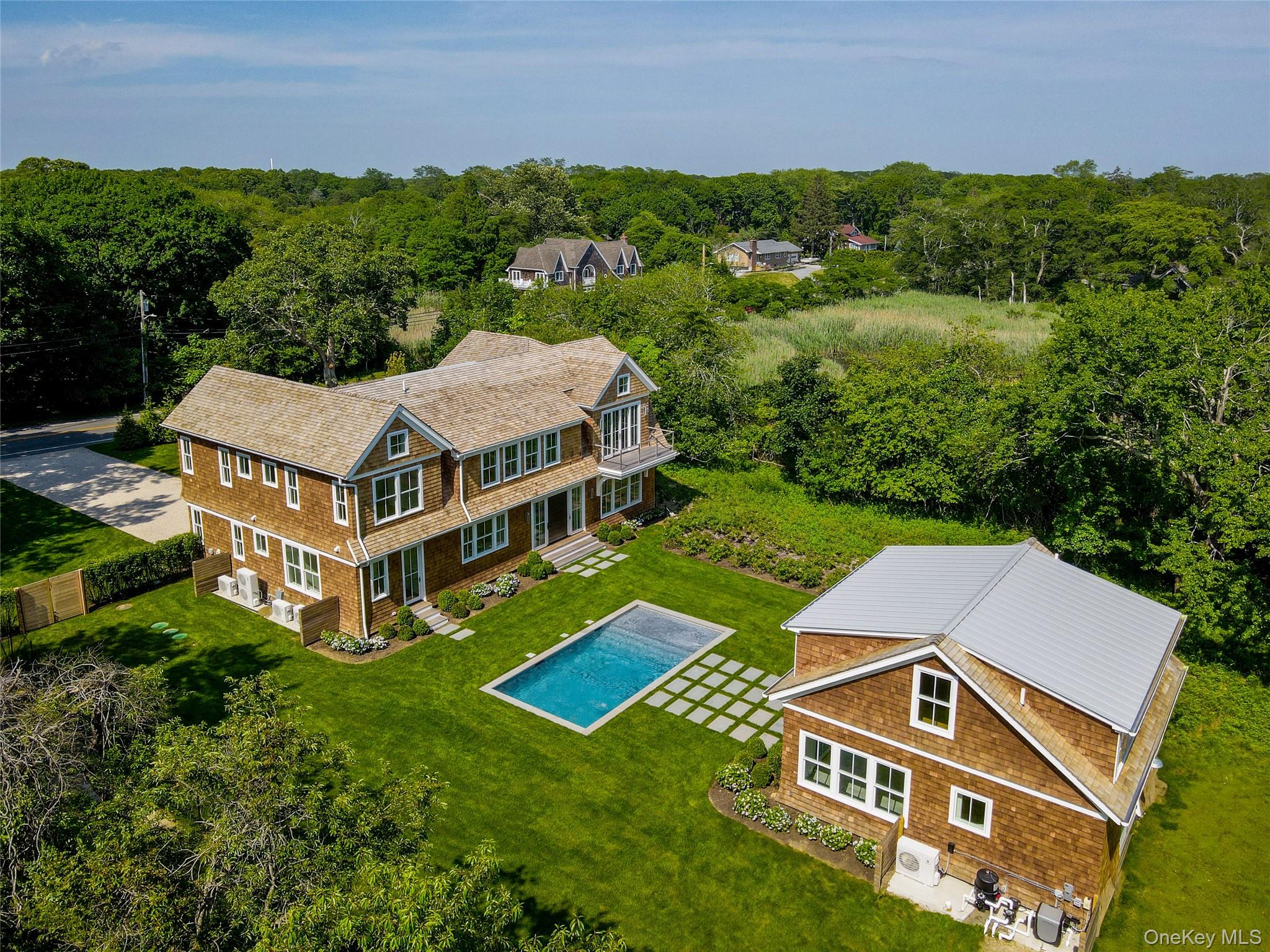 161 South Road Westhampton, NY 11977 - Photo 3 of 34 an aerial view of a house with a big yard