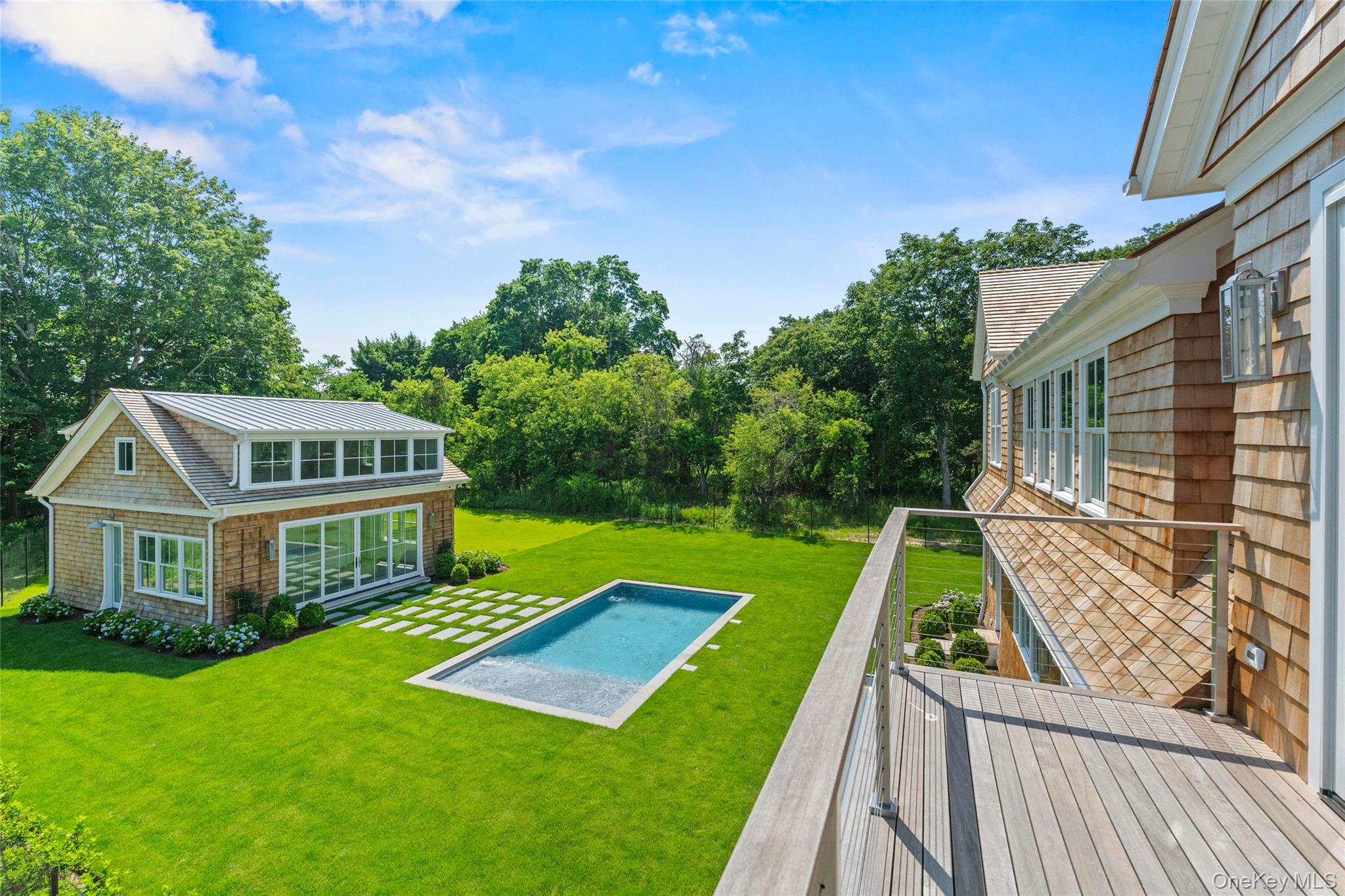 161 South Road Westhampton, NY 11977 - Photo 8 of 34 a view of a house with a yard deck and a small yard