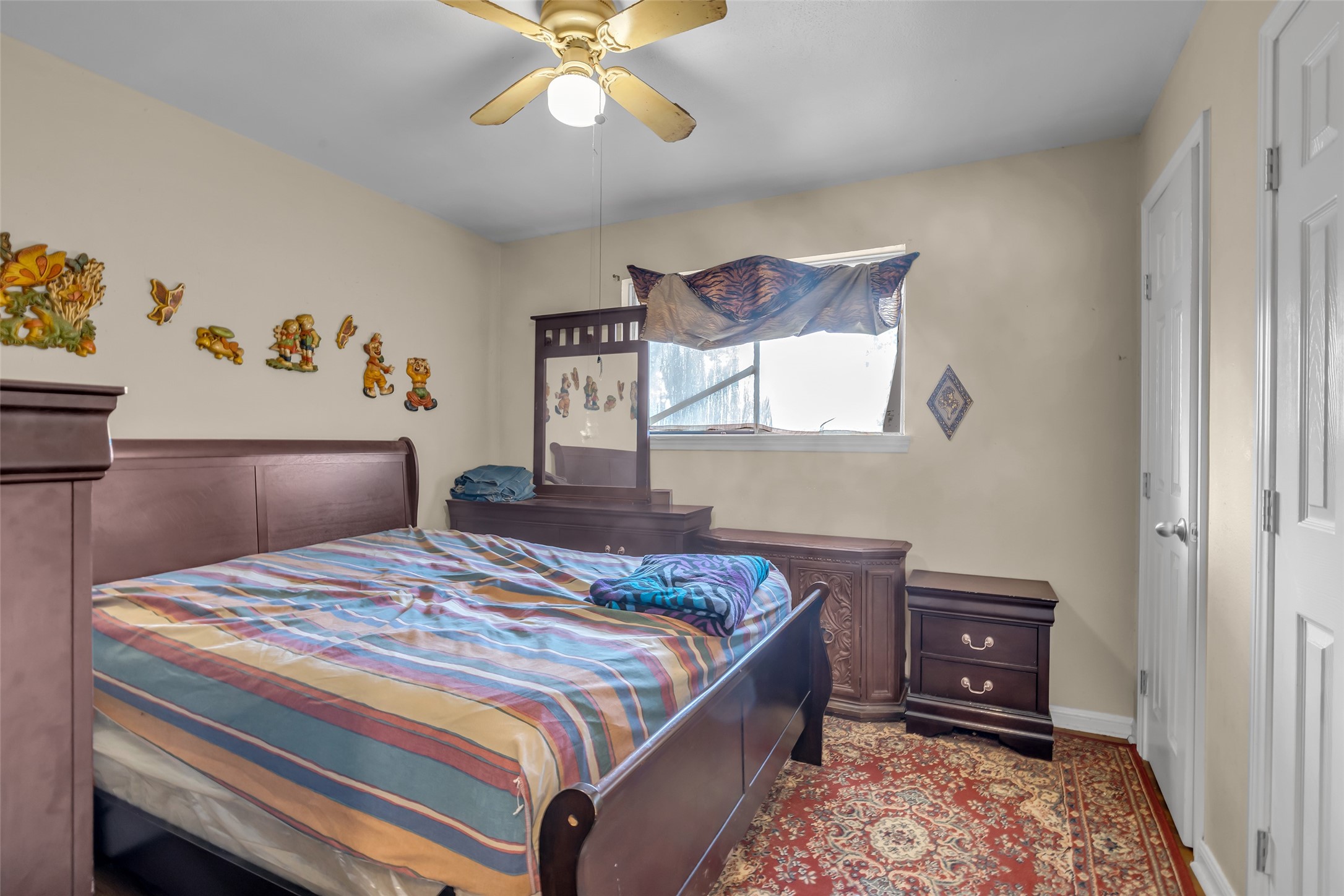 4903 Connorvale Road Houston, TX 77039 - Photo 15 of 28 a bedroom with a bed and dresser