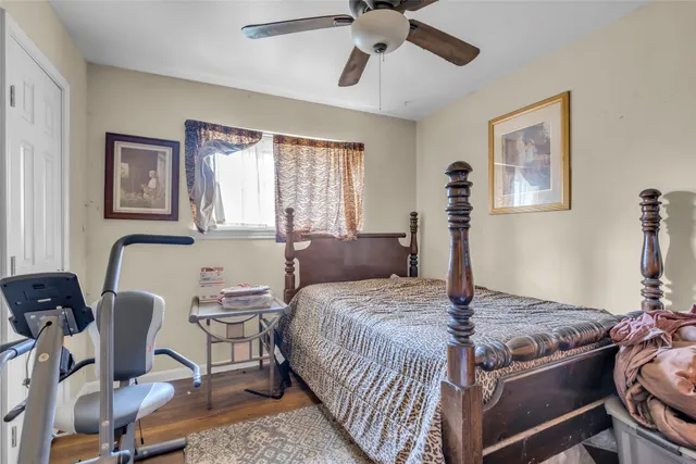 a bedroom with a bed and a desk