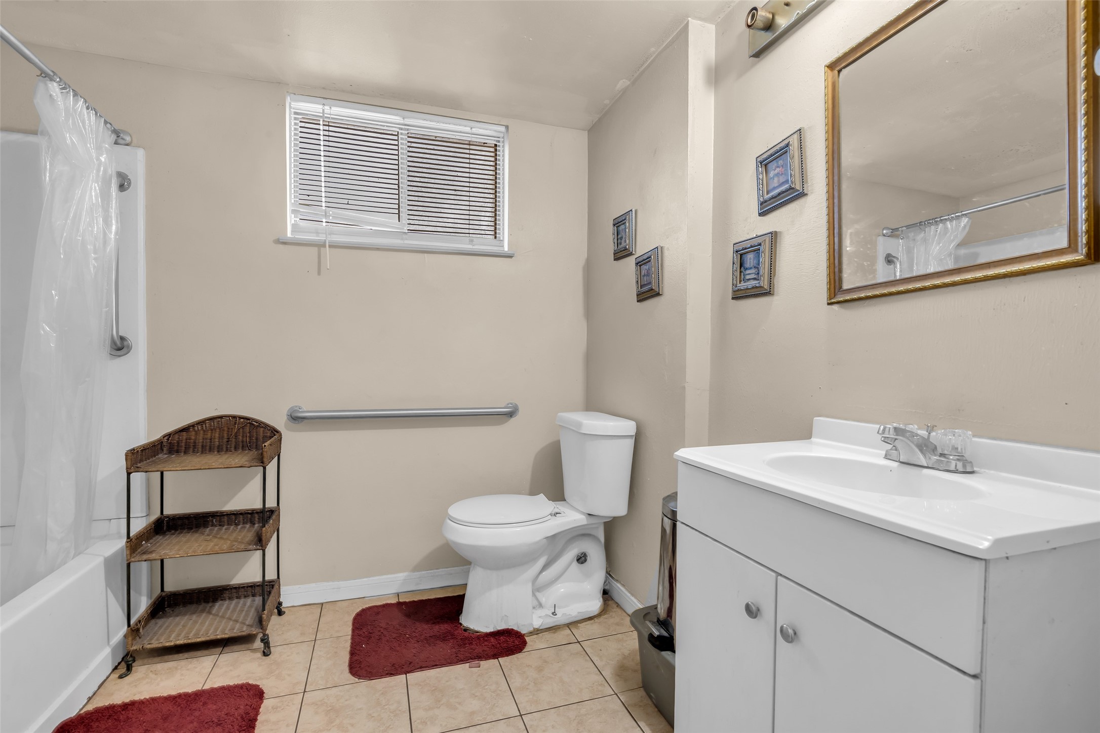 4903 Connorvale Road Houston, TX 77039 - Photo 17 of 28 a bath room with a toilet a sink and a mirror