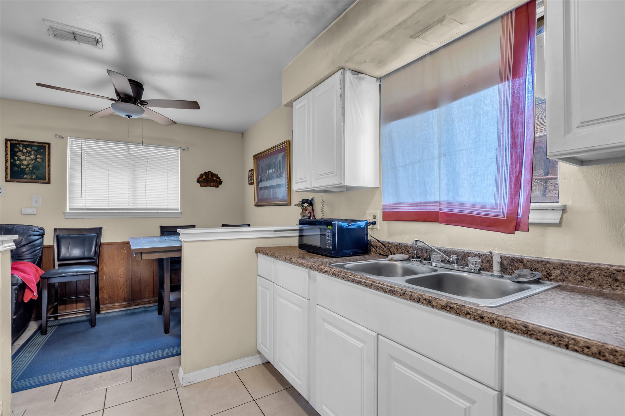 4903 Connorvale Road Houston, TX 77039 - Photo 24 of 28 a kitchen with granite countertop a sink stainless steel appliances and cabinets