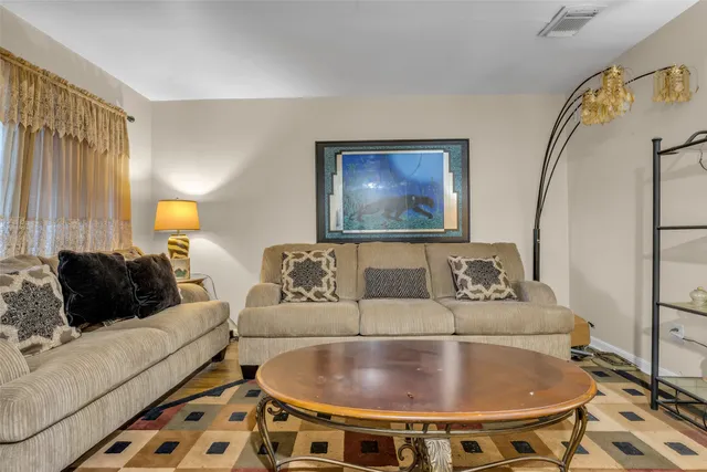 a living room with a couch and a table