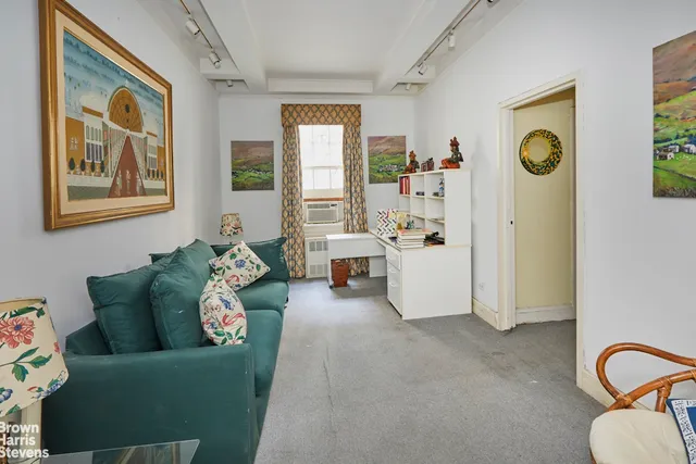 a living room with furniture and window