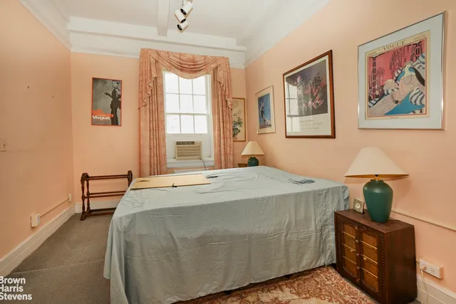 a bathroom with a tub sink vanity and mirror