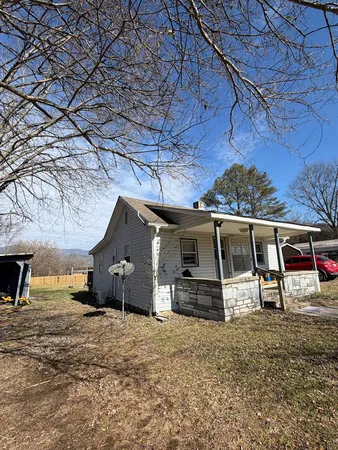 a front view of a house with parking