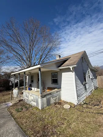 a view of a patio with table and chairs with wooden floor and fence