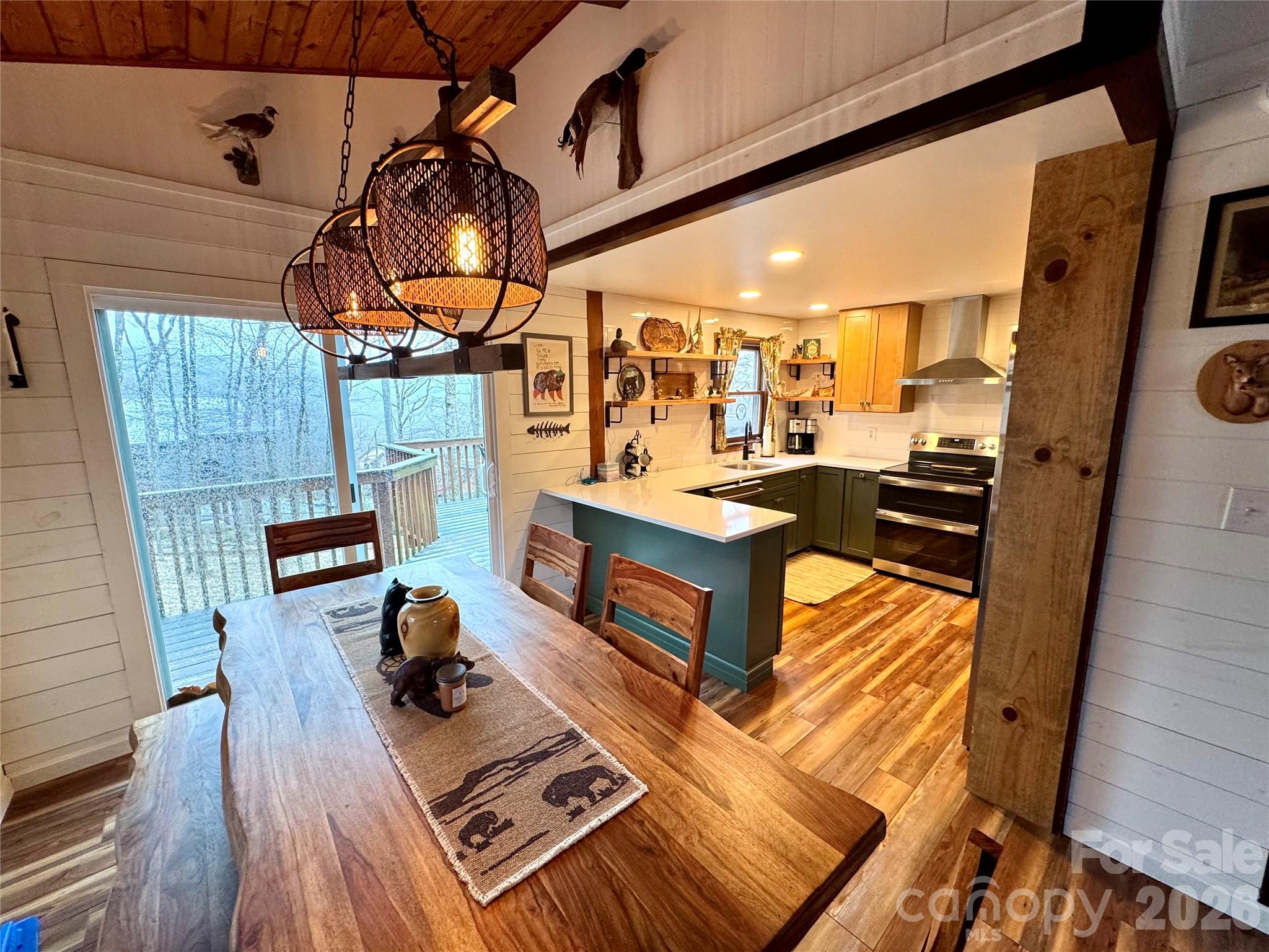 105 Pinnacle Ridge Road Beech Mountain, NC 28604 - Photo 13 of 38 a view of a livingroom with furniture and wooden floor