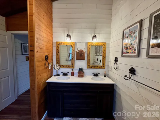 a bathroom with a double vanity sink