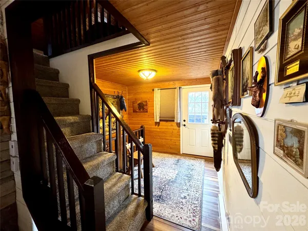 a view of a hallway with stairs