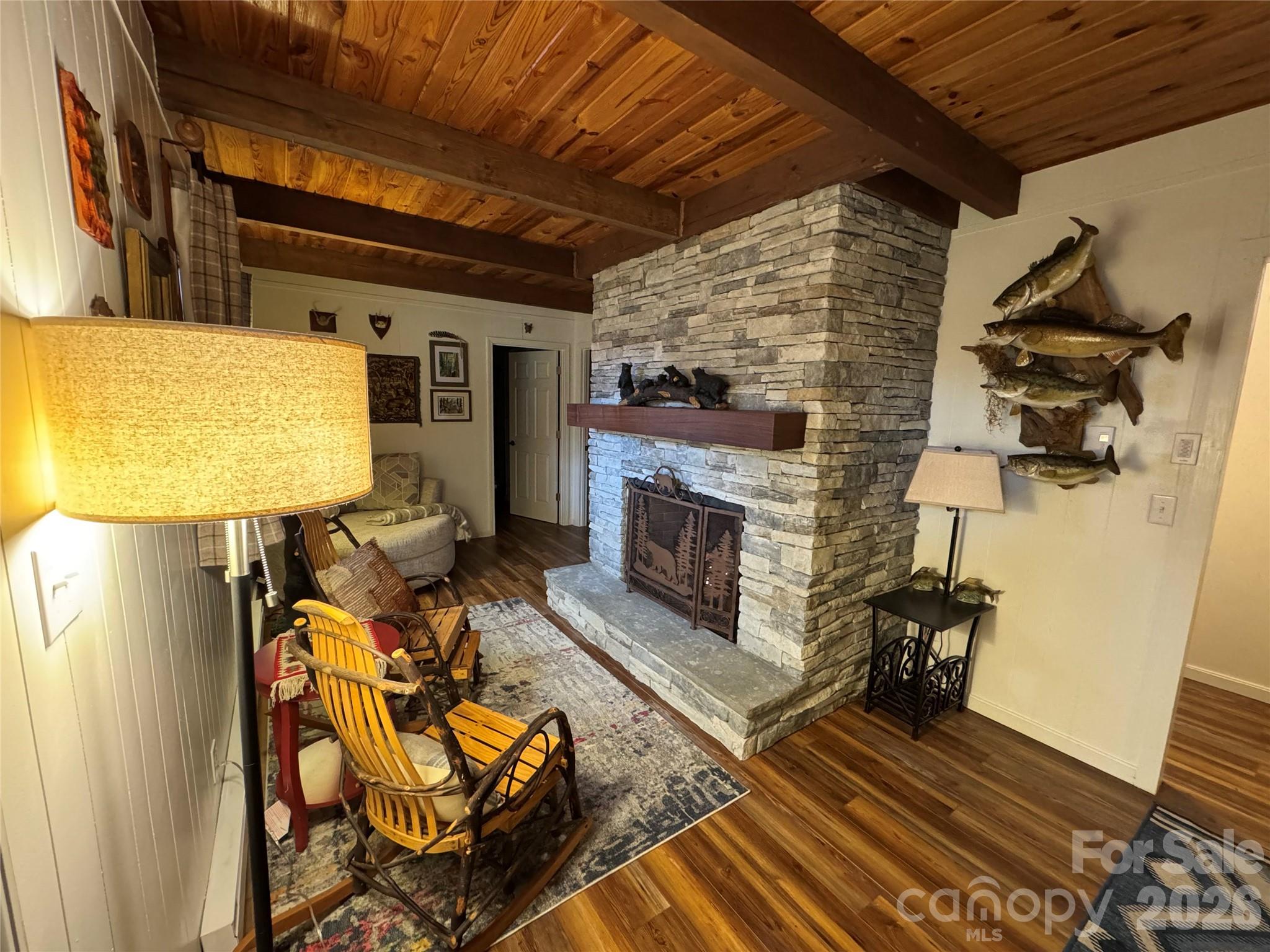 105 Pinnacle Ridge Road Beech Mountain, NC 28604 - Photo 25 of 38 a living room with furniture and a fireplace