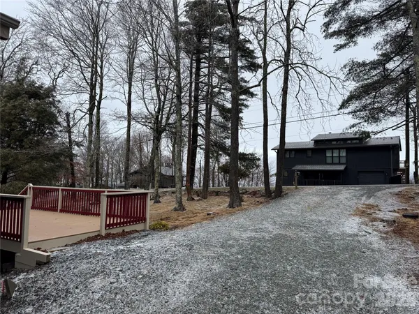 a view of house with outdoor space and shower