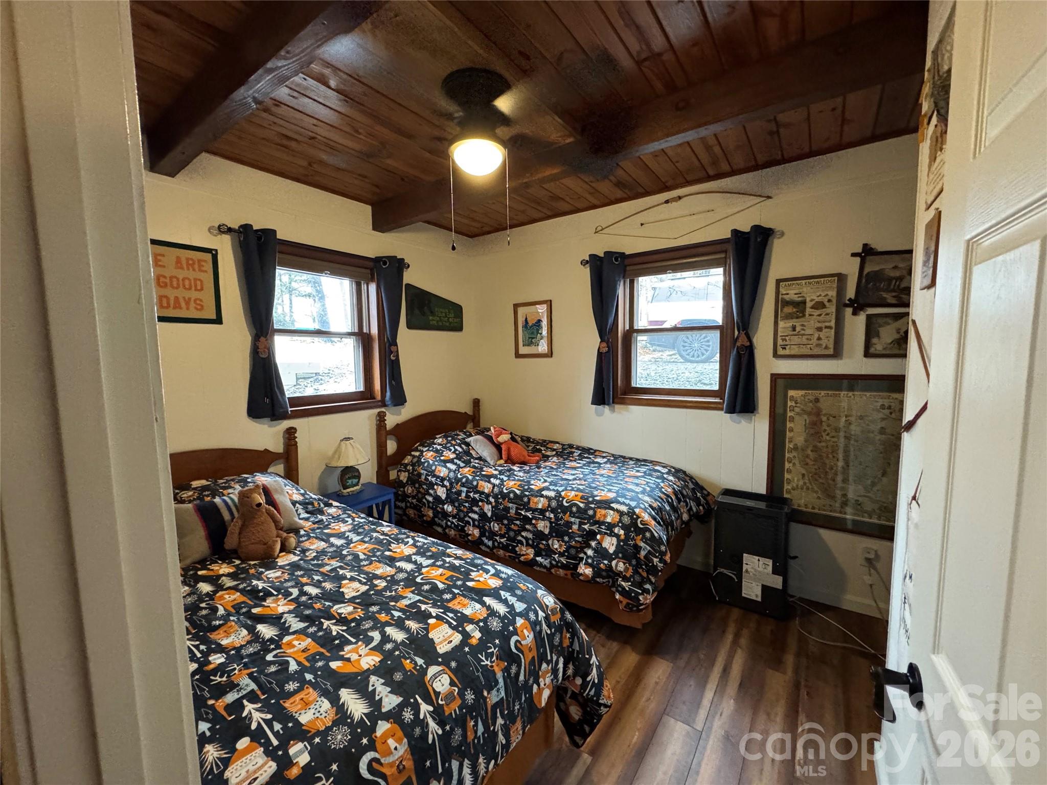 105 Pinnacle Ridge Road Beech Mountain, NC 28604 - Photo 32 of 38 a bedroom with bed and a window