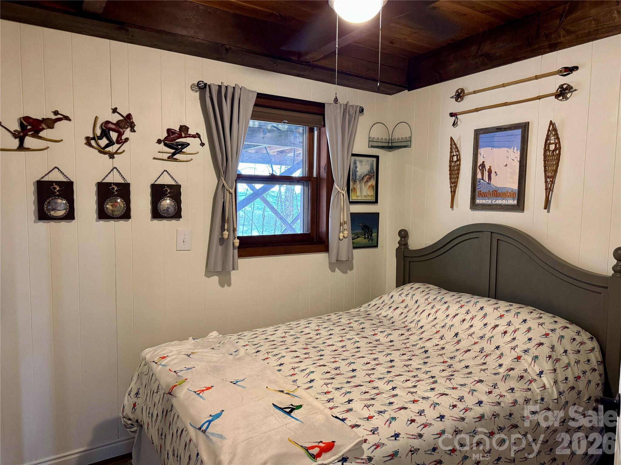 105 Pinnacle Ridge Road Beech Mountain, NC 28604 - Photo 35 of 38 a bedroom with a bed and a painting on the wall