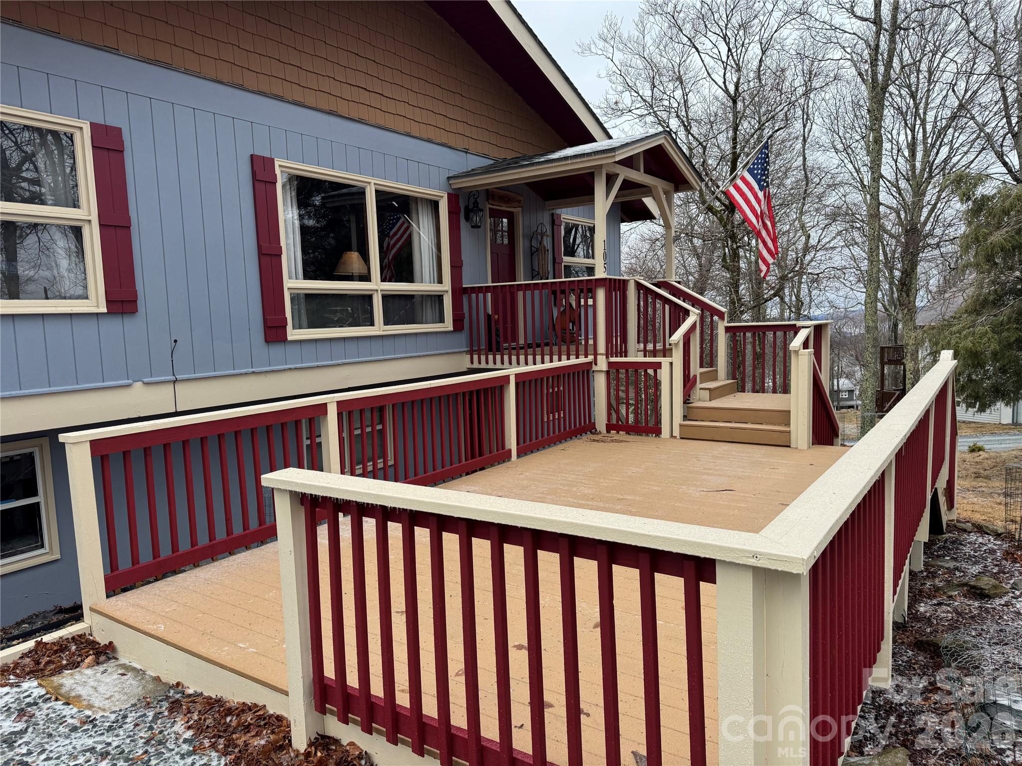 105 Pinnacle Ridge Road Beech Mountain, NC 28604 - Photo 4 of 38 a front view of a house with a yard