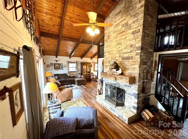 a view of a livingroom with furniture and a fireplace