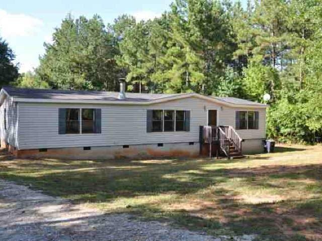 4476 Cook Road Monticello, GA 31064 - Photo 1 of 1 a view of a house with a patio and a yard