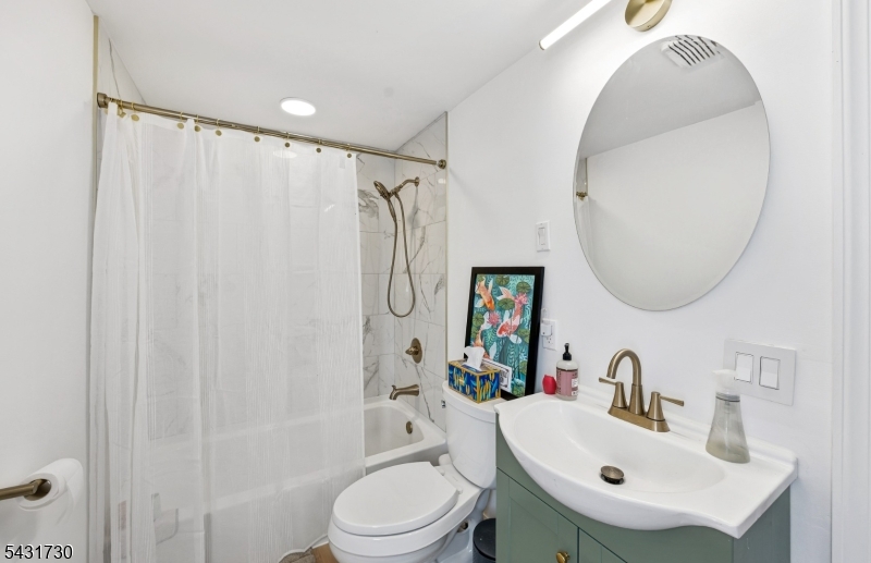 105 Main Street Lebanon, NJ 08833 - Photo 12 of 25 a bathroom with a sink toilet and shower
