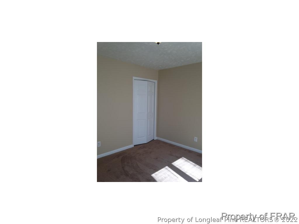 203 Duncan Road Spring Lake, NC 28390 - Photo 14 of 26 a picture of a bench in a room