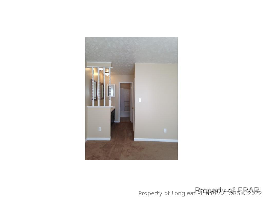 203 Duncan Road Spring Lake, NC 28390 - Photo 18 of 26 a picture of a living room with a bench