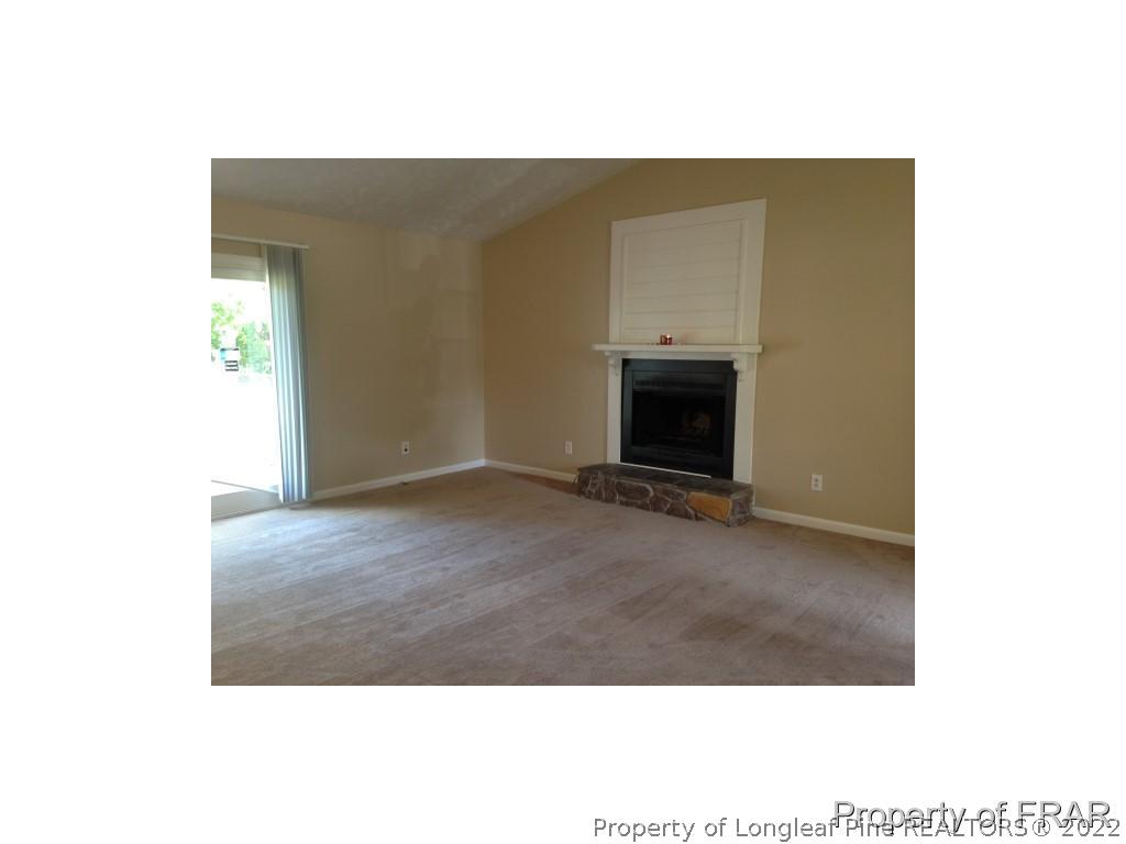 203 Duncan Road Spring Lake, NC 28390 - Photo 4 of 26 a view of an empty room with wooden floor