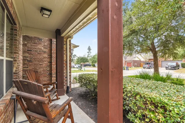 a view of a balcony with chairs and a table