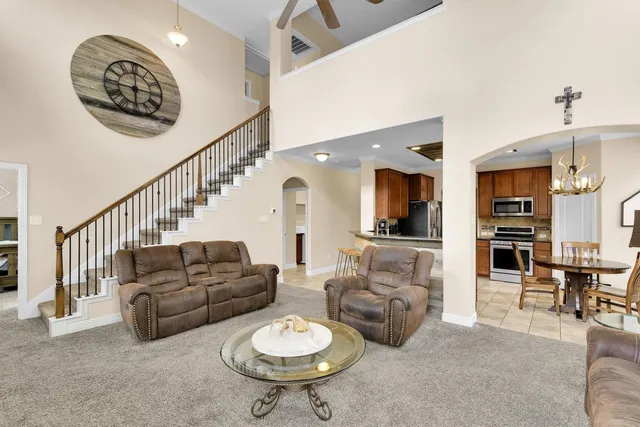 a living room with furniture and a table