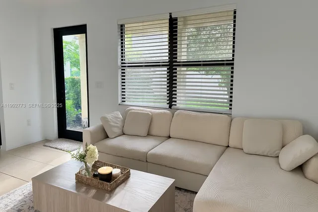 a living room with furniture and a window