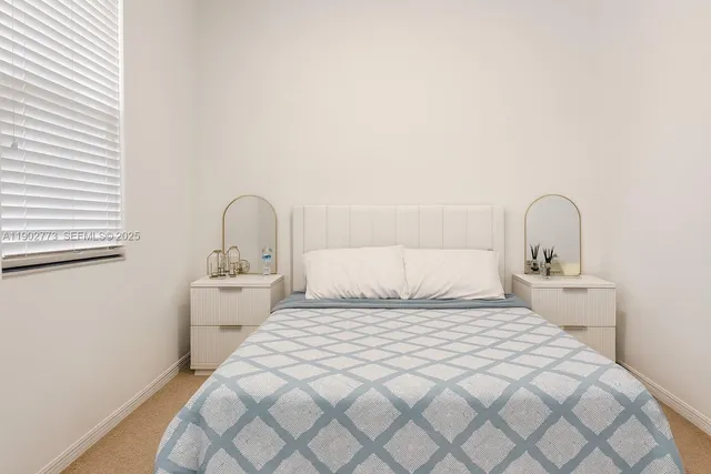 a bedroom with a bed and a sink