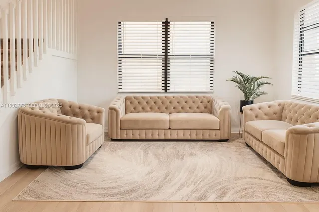 a living room with furniture and a large window