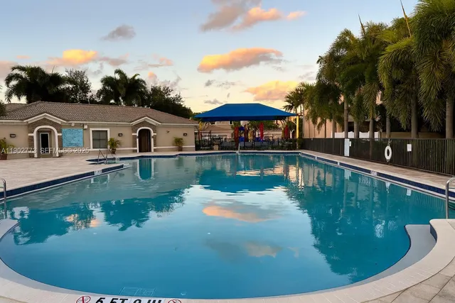 a view of a house with swimming pool