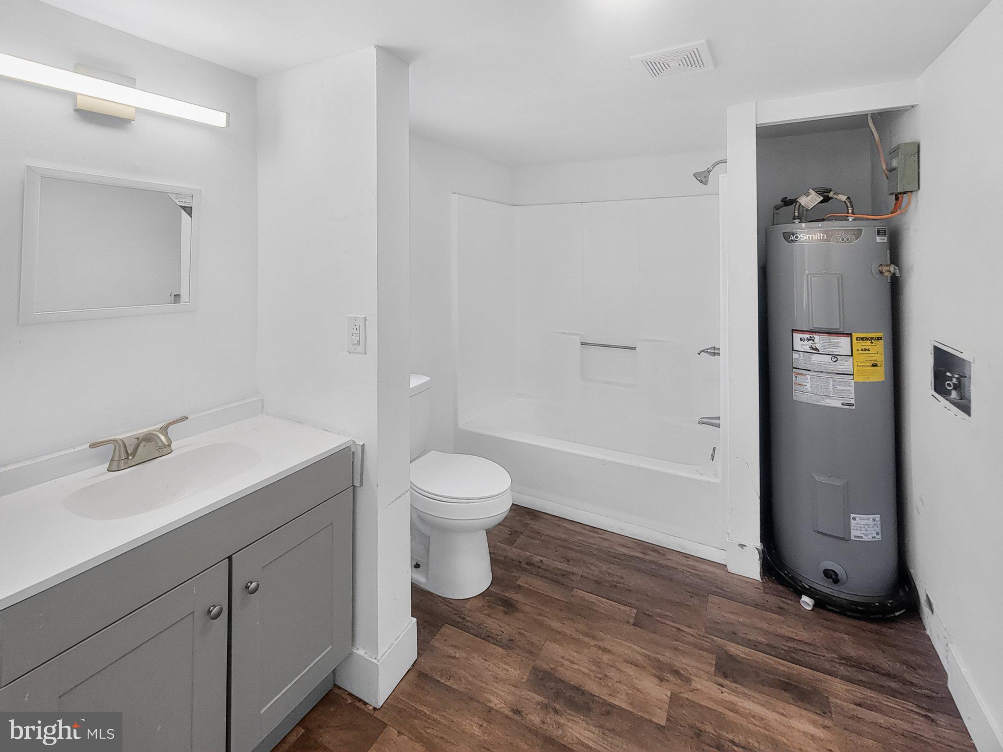 4658 White Marsh Road Madison, MD 21648 - Photo 19 of 25 a bathroom with a sink toilet and shower