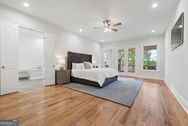 a view of a room with furniture and a large window