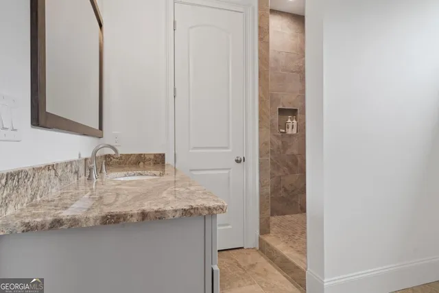 a view of empty room with wooden floor and window