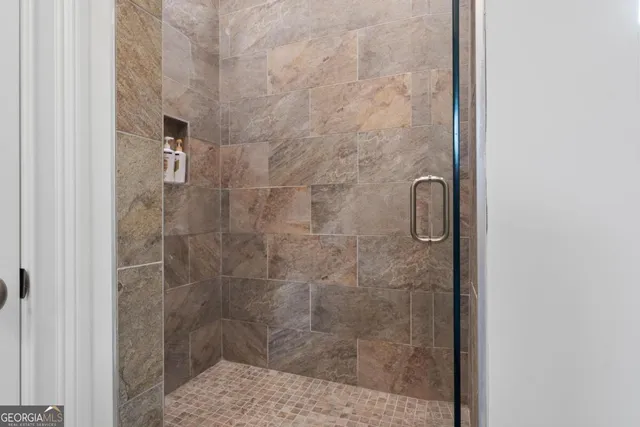 a kitchen with wooden floors and appliances