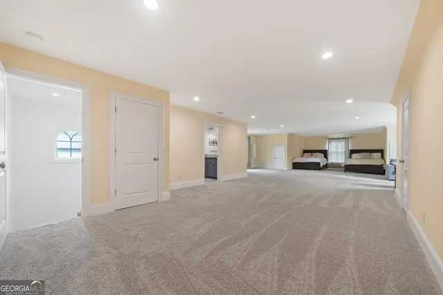 a bedroom with a bed and a television