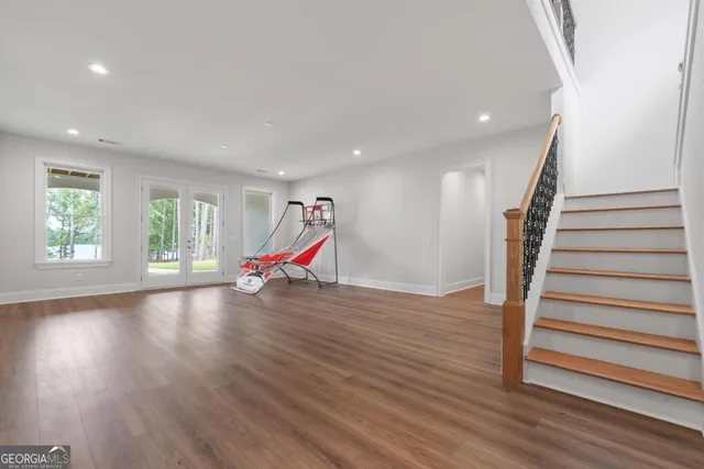 a front view of a house with swimming pool and porch