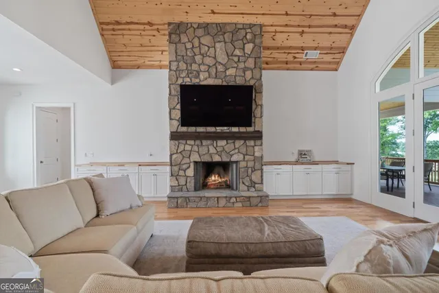 a kitchen with stainless steel appliances granite countertop a stove and a white cabinets