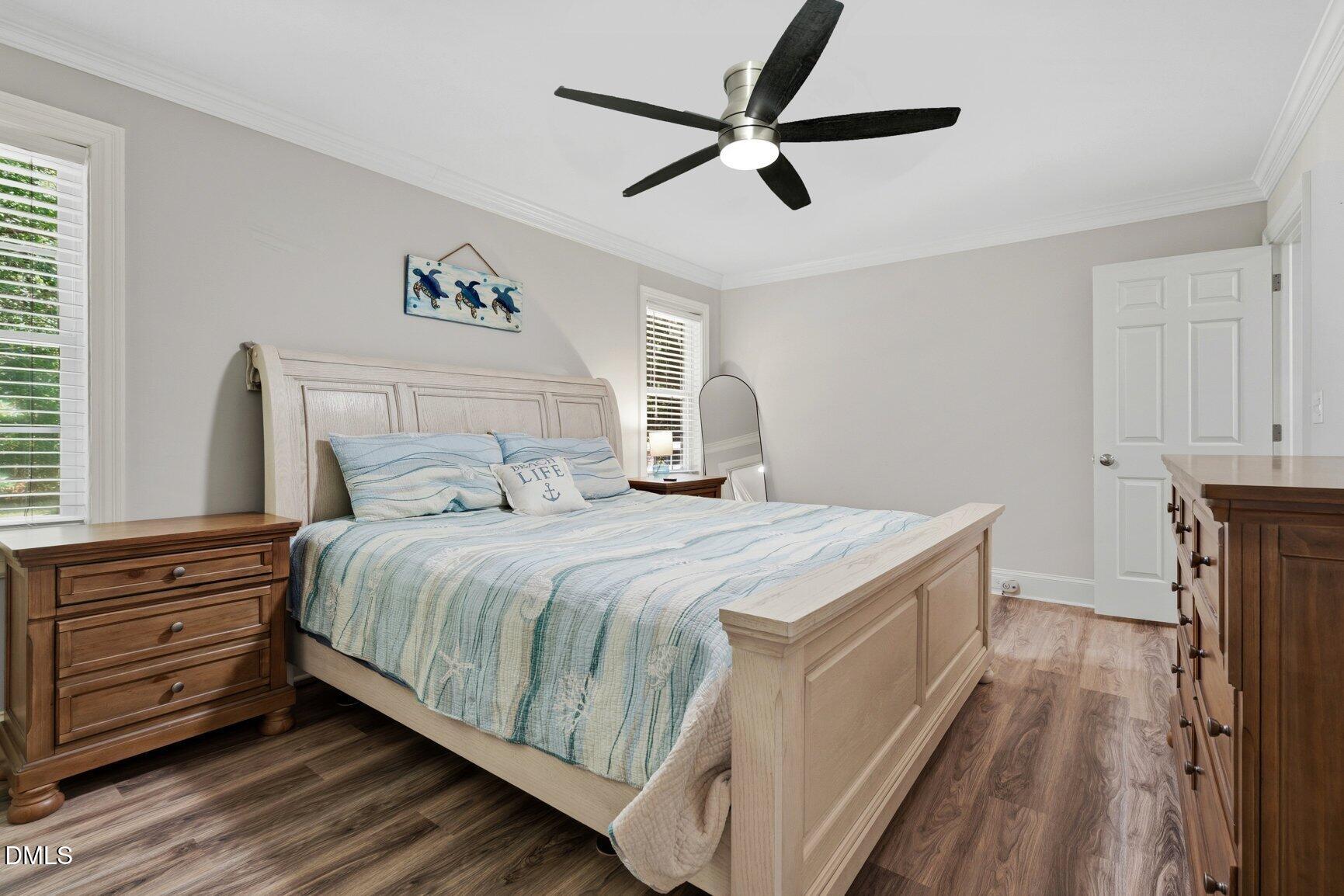726 Thomas Road Rocky Mount, NC 27801 - Photo 19 of 55 a bedroom with a bed and a ceiling fan