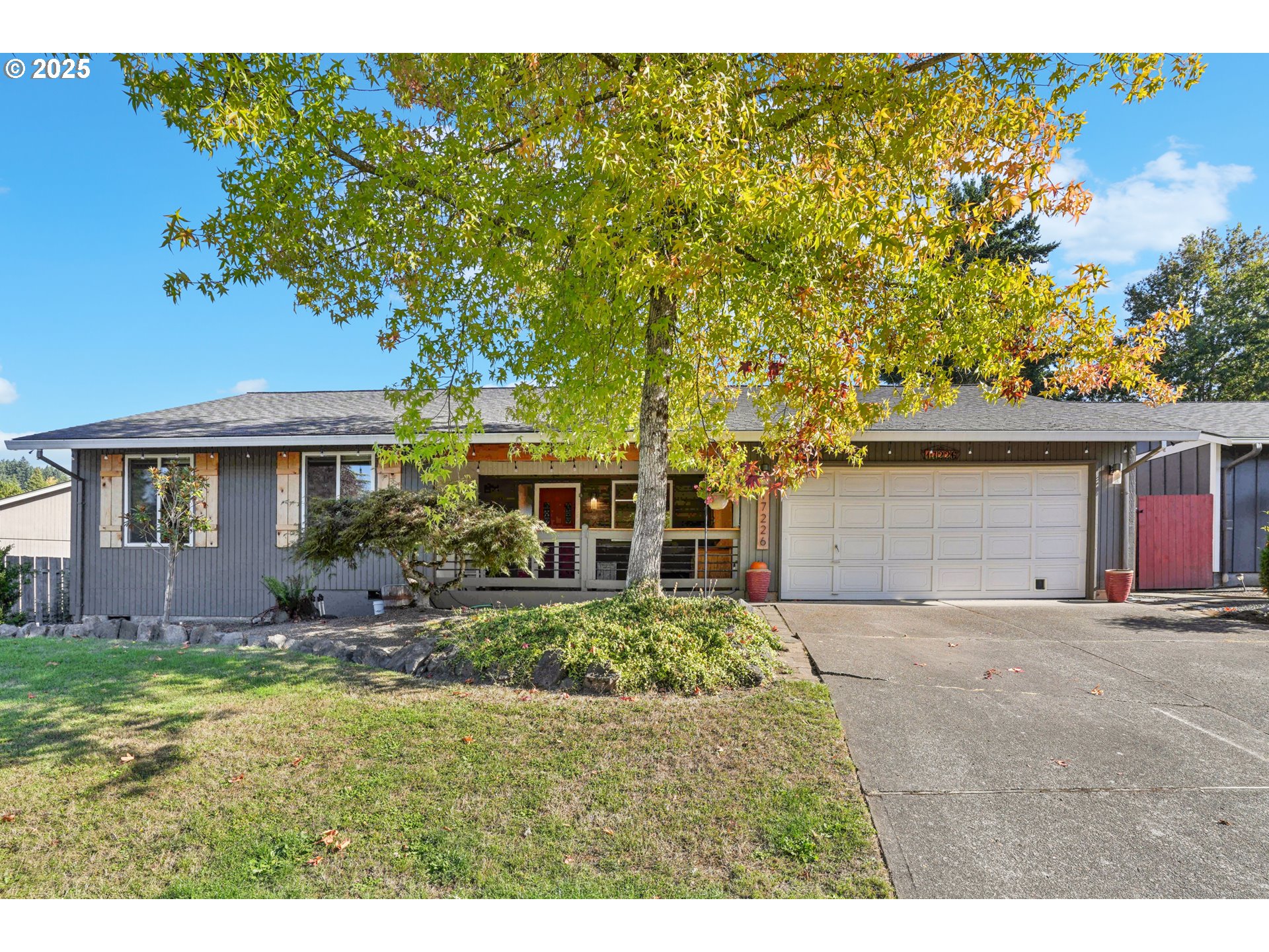 17226 Southwest Baker Street Beaverton, OR 97007 - Photo 1 of 34 a view of a house with garden and yard