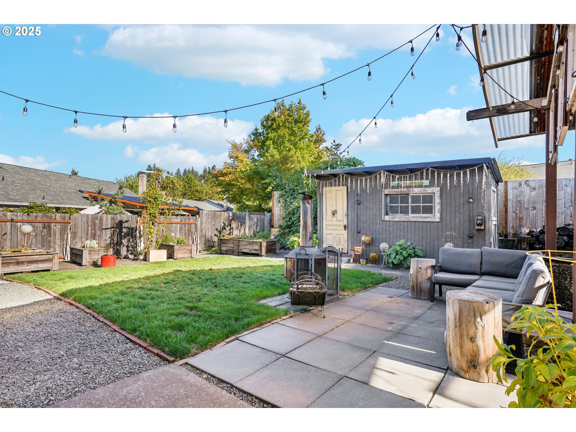 17226 Southwest Baker Street Beaverton, OR 97007 - Photo 28 of 34 a view of a patio with couches and a table and chairs