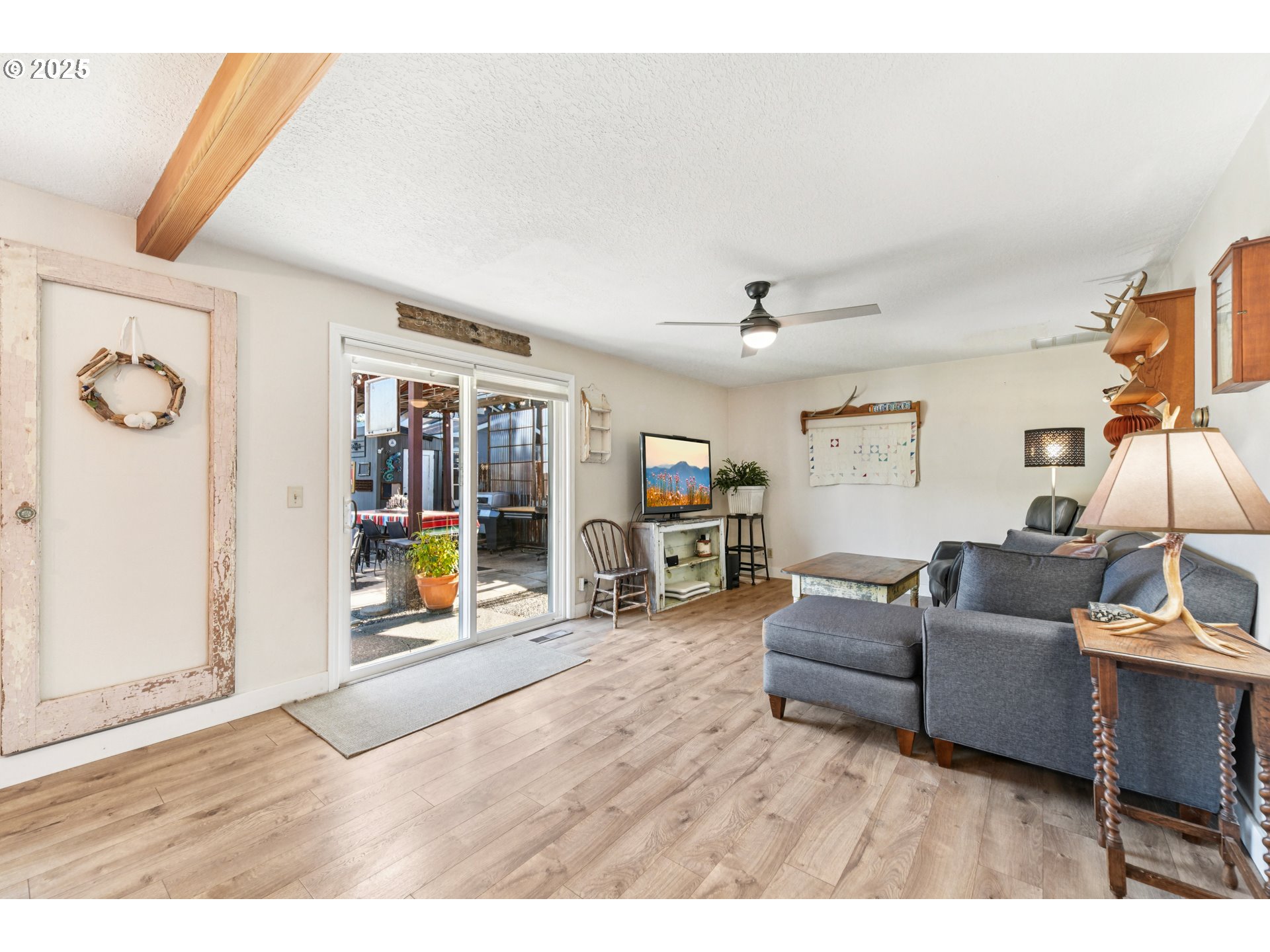 17226 Southwest Baker Street Beaverton, OR 97007 - Photo 3 of 34 a living room with furniture and a wooden floor