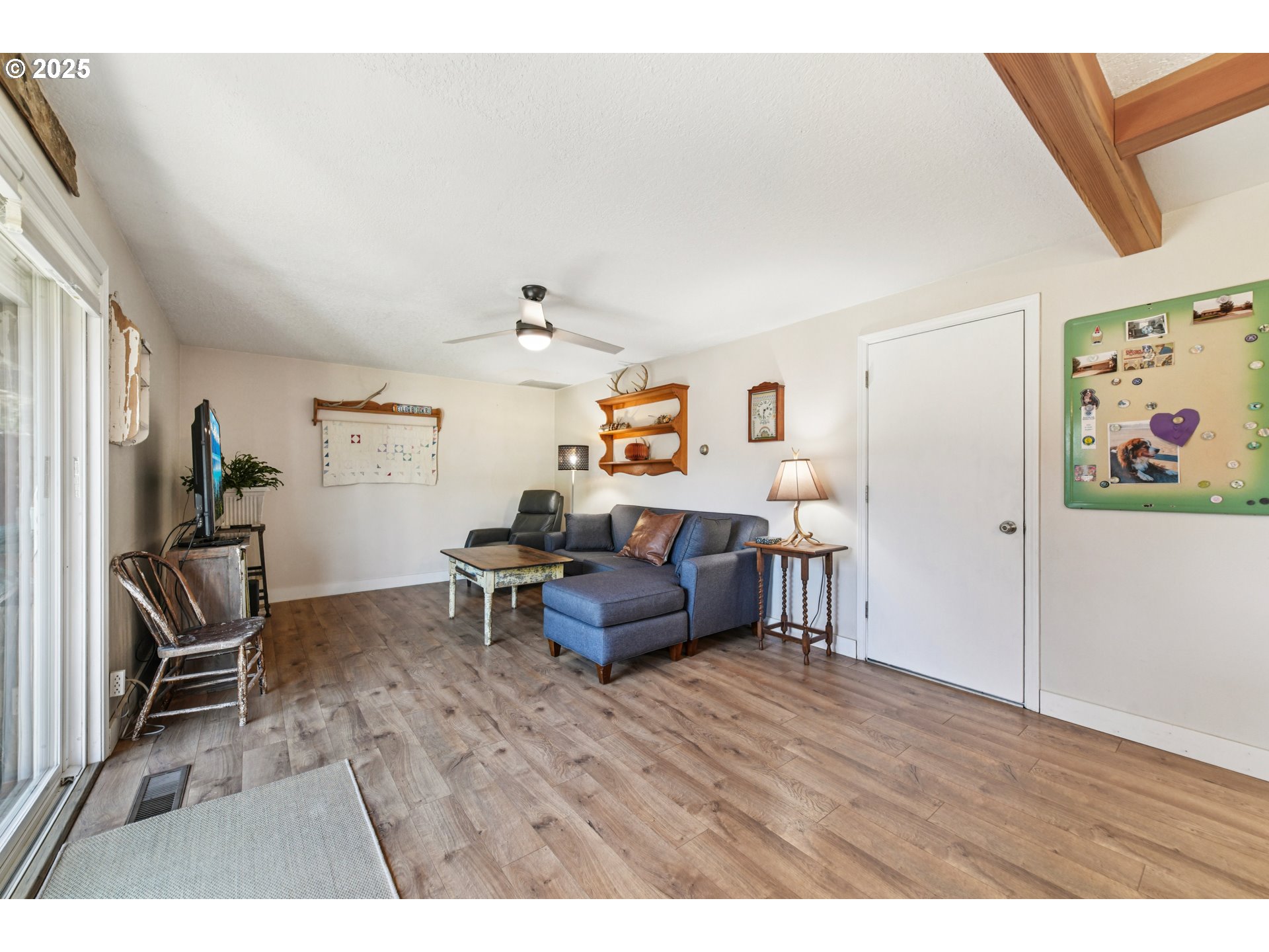 17226 Southwest Baker Street Beaverton, OR 97007 - Photo 7 of 34 a living room with furniture and a flat screen tv