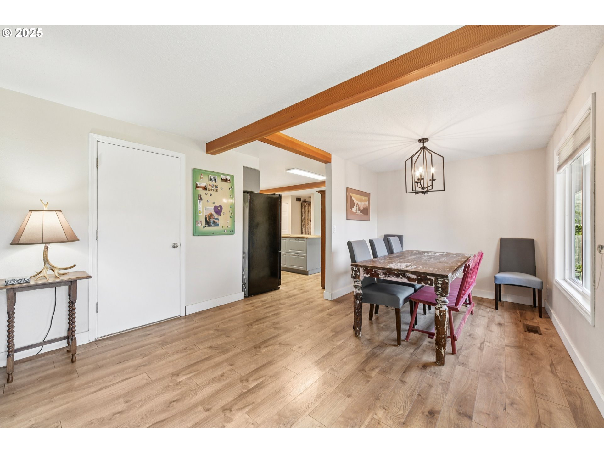17226 Southwest Baker Street Beaverton, OR 97007 - Photo 9 of 34 a view of a dining room with furniture and wooden floor