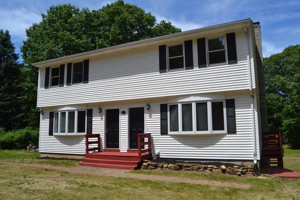 61 Monson Road Wales, MA 01081 - Photo 1 of 41 a front view of a house with a yard
