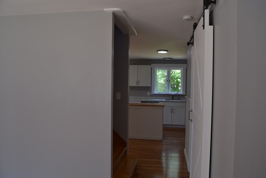 61 Monson Road Wales, MA 01081 - Photo 13 of 41 a kitchen with granite countertop white cabinets and white appliances