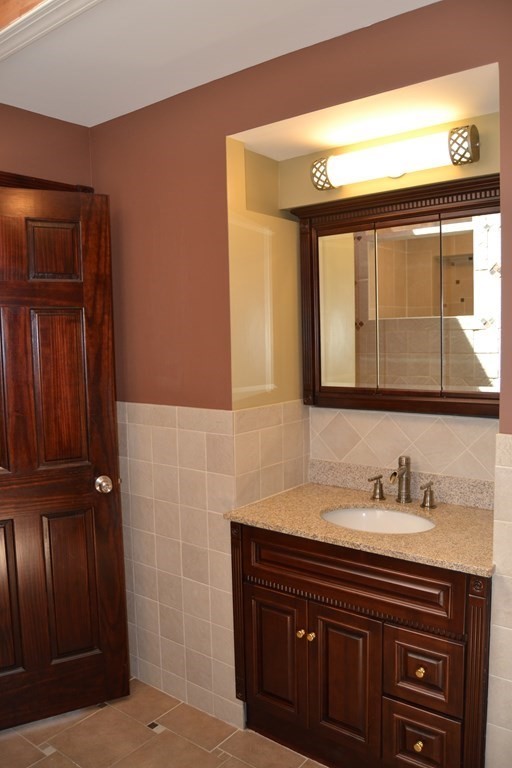61 Monson Road Wales, MA 01081 - Photo 20 of 41 a bathroom with a sink a vanity and a mirror