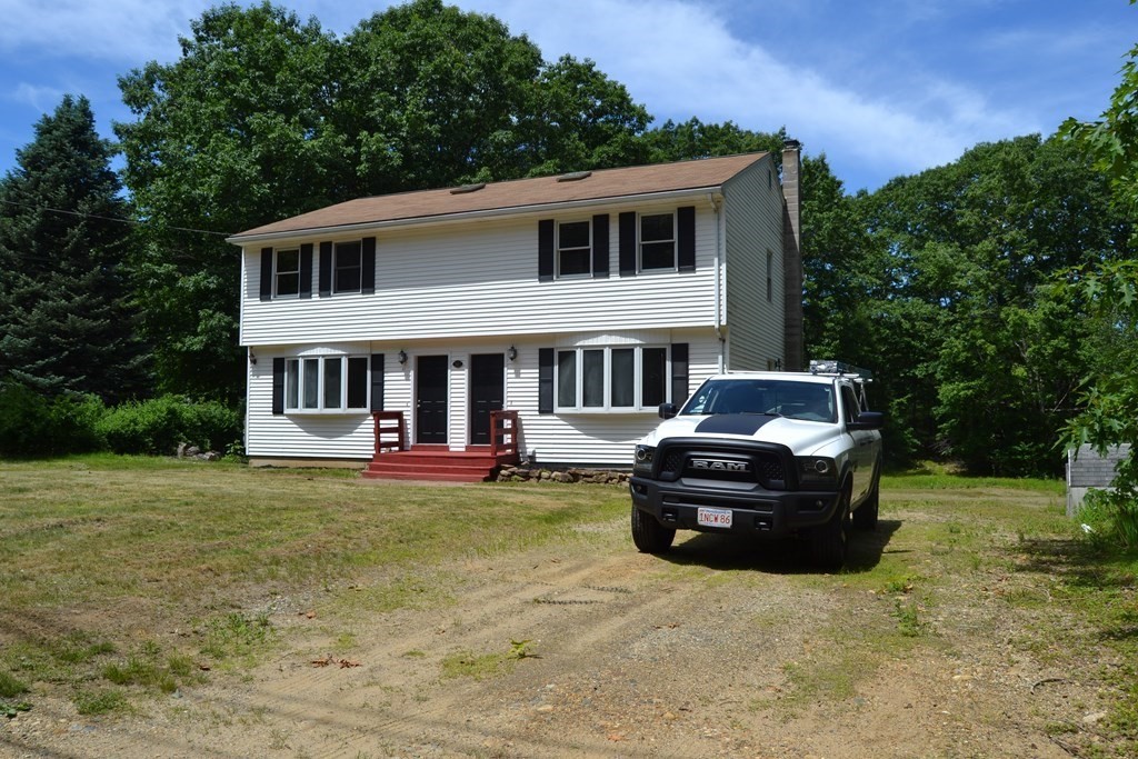 61 Monson Road Wales, MA 01081 - Photo 2 of 41 a car parked in front of a house