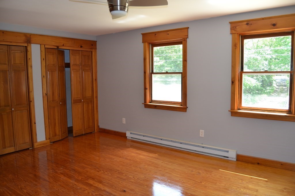 61 Monson Road Wales, MA 01081 - Photo 24 of 41 an empty room with wooden floor and windows