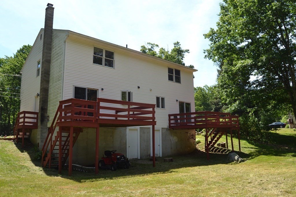 61 Monson Road Wales, MA 01081 - Photo 3 of 41 a view of a house with backyard swimming pool